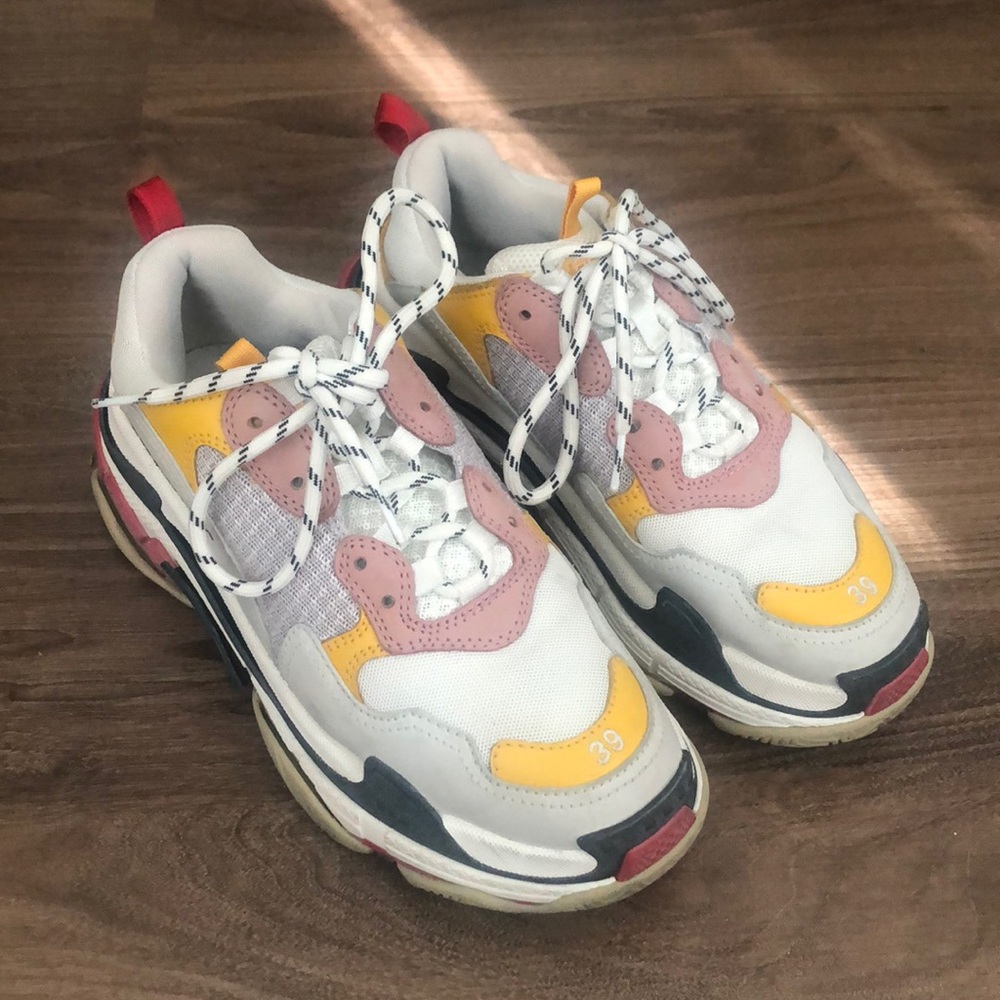 Balenciaga Triple S yellow pink sneakers.